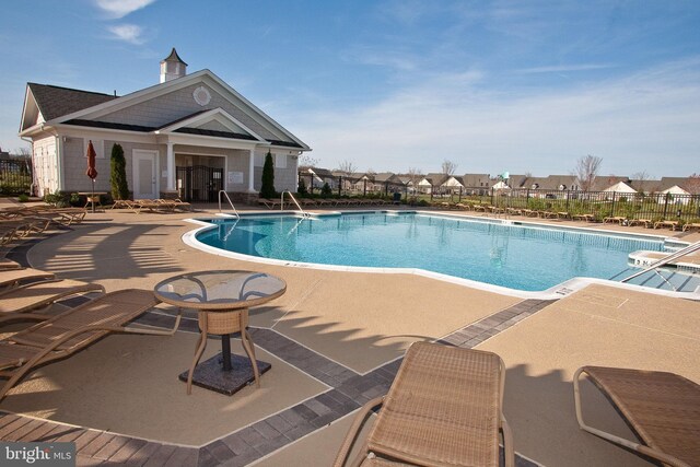 44365 Adare Manor Sq, Ashburn, VA 20147 - community pool with a patio area