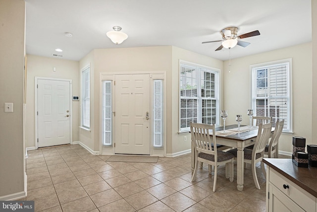 44365 Adare Manor Sq, Ashburn, VA 20147 - entrance foyer with ceiling fan, healthy amount of natural light, light tile patterned floors, and baseboards