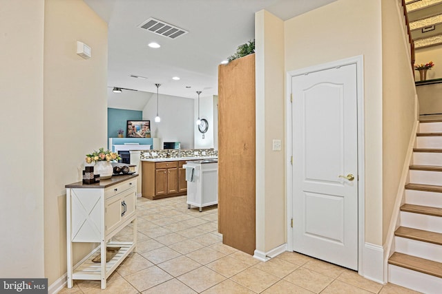 44365 Adare Manor Sq, Ashburn, VA 20147 - kitchen with light tile patterned floors, baseboards, recessed lighting, and hanging light fixtures