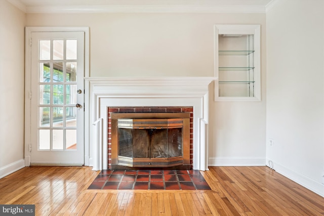 1918 Brisbane St, Silver Spring, MD 20902 - detailed view of a fireplace, wood finished floors, ornamental molding, and baseboards