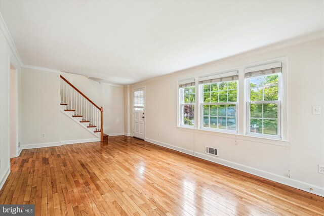 1918 Brisbane St, Silver Spring, MD 20902 - unfurnished living room featuring stairway, crown molding, light wood finished floors, and baseboards