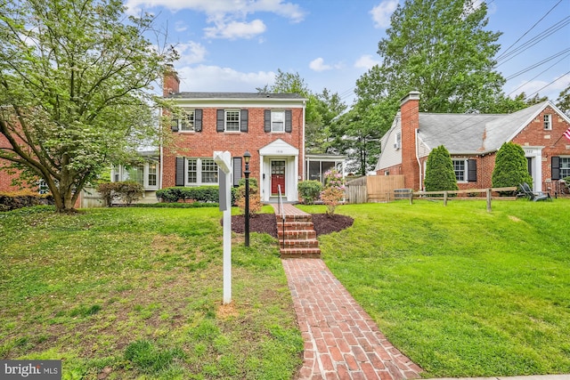 1918 Brisbane St, Silver Spring, MD 20902 - view of front of house featuring brick siding and a chimney