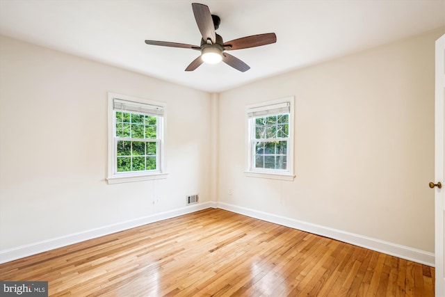 1918 Brisbane St, Silver Spring, MD 20902 - empty room with healthy amount of natural light, wood-type flooring, and baseboards
