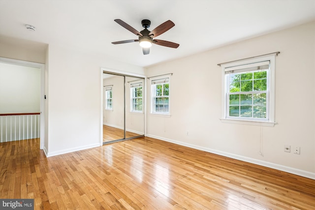 1918 Brisbane St, Silver Spring, MD 20902 - unfurnished bedroom featuring light wood-style flooring, a closet, baseboards, and a ceiling fan