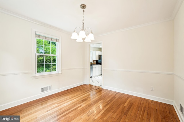 1918 Brisbane St, Silver Spring, MD 20902 - unfurnished dining area featuring crown molding, a chandelier, wood-type flooring, and baseboards