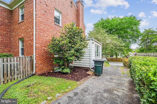 1918 Brisbane St, Silver Spring, MD 20902 - view of home's exterior featuring fence and brick siding