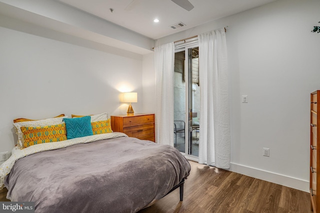 bedroom with access to exterior, recessed lighting, baseboards, wood finished floors, and visible vents