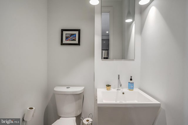half bath with vanity and toilet