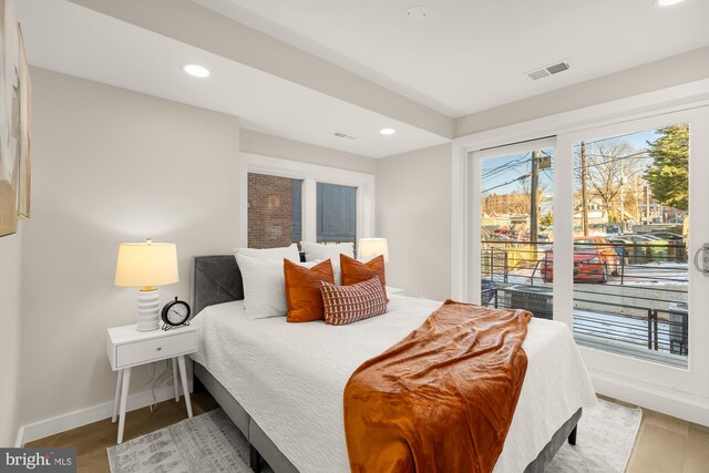 2639 41st St NW Unit 3, Washington, DC 20007 - bedroom with visible vents, access to exterior, baseboards, recessed lighting, and wood finished floors