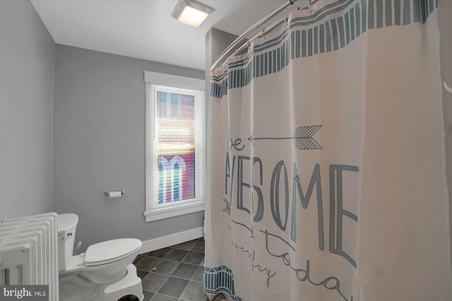 115 Penn St, Millheim, PA 16854 - bathroom featuring baseboards, tile patterned flooring, toilet, and curtained shower