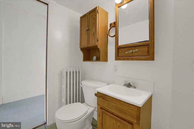 115 Penn St, Millheim, PA 16854 - bathroom with radiator, vanity, and toilet