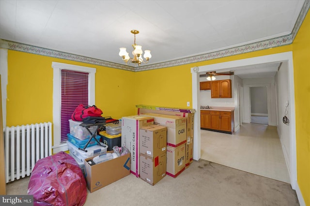 115 Penn St, Millheim, PA 16854 - dining area with light colored carpet, radiator heating unit, and a notable chandelier