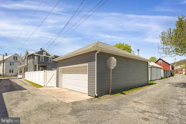 115 Penn St, Millheim, PA 16854 - garage featuring fence and aphalt driveway
