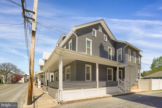 115 Penn St, Millheim, PA 16854 - farmhouse with fence and covered porch