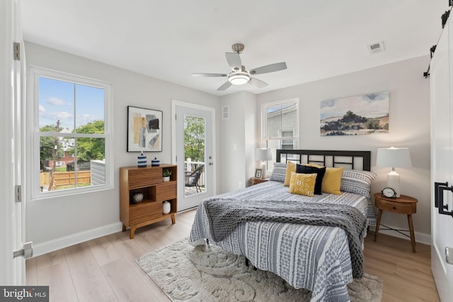 17 Longfellow St NW, Washington, DC 20011 - bedroom with multiple windows, access to exterior, light wood-style floors, and ceiling fan