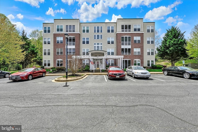 view of property featuring uncovered parking