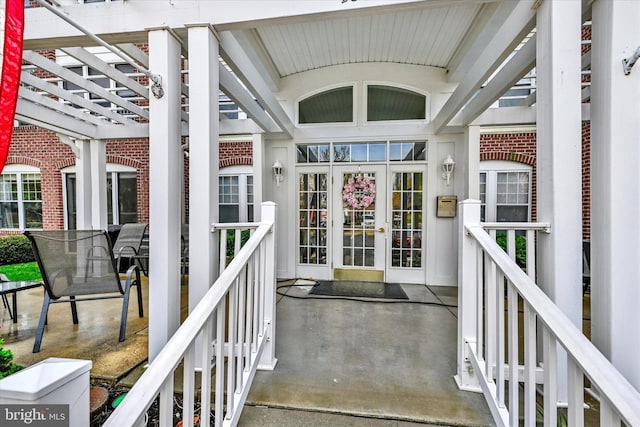 entrance to property featuring brick siding