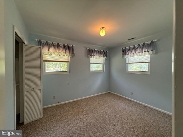 2260 Iberis Rd, Lancaster, VA 22503 - unfurnished bedroom with a closet, visible vents, carpet floors, and baseboards