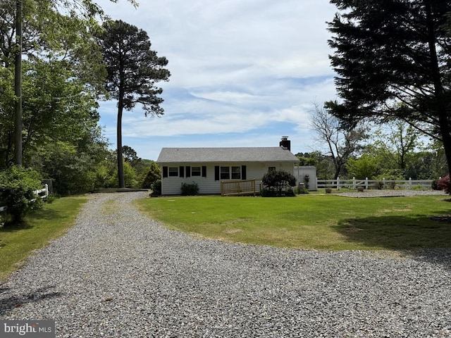 2260 Iberis Rd, Lancaster, VA 22503 - view of front facade with fence, a chimney, driveway, and a front yard