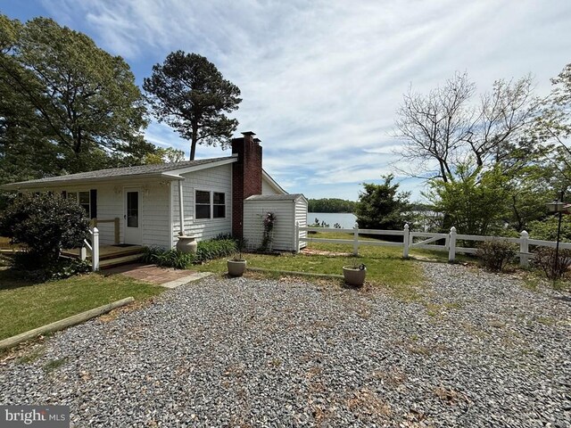 2260 Iberis Rd, Lancaster, VA 22503 - view of front facade with a chimney and fence