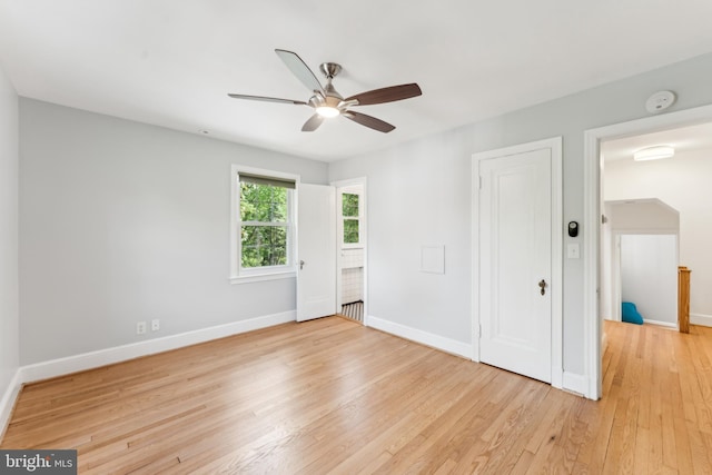 1111 Woodside Pkwy, Silver Spring, MD 20910 - unfurnished bedroom with baseboards, ceiling fan, and light wood-type flooring