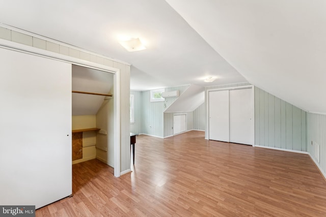 1111 Woodside Pkwy, Silver Spring, MD 20910 - additional living space with baseboards, light wood-style flooring, and lofted ceiling