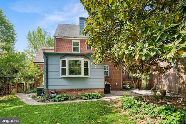 1111 Woodside Pkwy, Silver Spring, MD 20910 - rear view of property with fence, a patio, brick siding, central air condition unit, and a yard