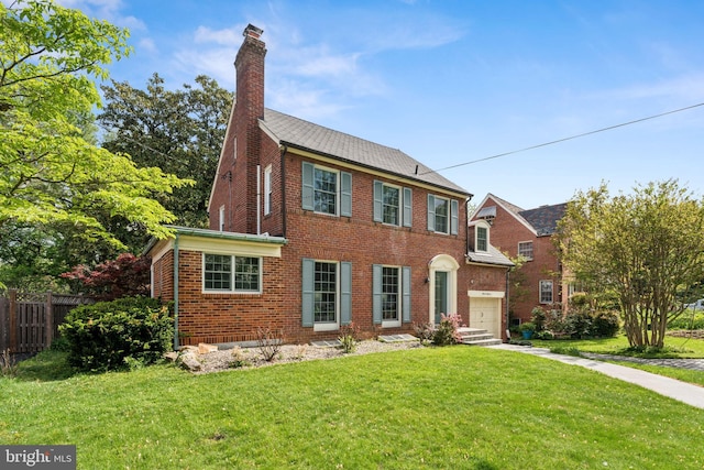 1111 Woodside Pkwy, Silver Spring, MD 20910 - colonial home with fence, brick siding, a garage, a front yard, and a chimney