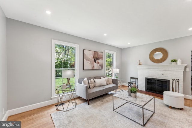 1111 Woodside Pkwy, Silver Spring, MD 20910 - living room with recessed lighting, wood finished floors, and a fireplace