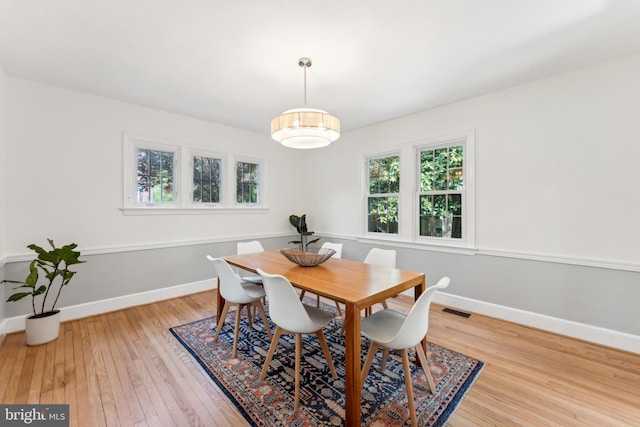 1111 Woodside Pkwy, Silver Spring, MD 20910 - dining space with light wood-type flooring, baseboards, and visible vents