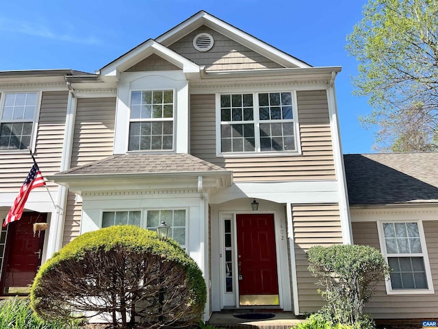 view of front of house with roof with shingles