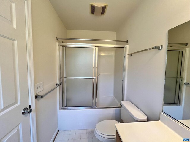 bathroom featuring visible vents, toilet, enclosed tub / shower combo, and vanity