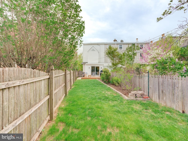 view of yard with a fenced backyard