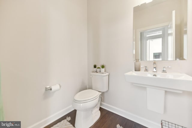 1702 River Sandstone Ter SE, Leesburg, VA 20175 - bathroom featuring baseboards, toilet, wood finished floors, and a sink