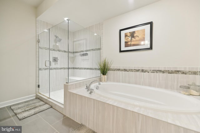 1702 River Sandstone Ter SE, Leesburg, VA 20175 - bathroom featuring tile patterned floors, a garden tub, and a stall shower