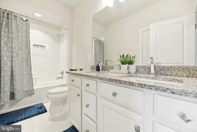 1702 River Sandstone Ter SE, Leesburg, VA 20175 - bathroom featuring double vanity, toilet, tile patterned floors, and shower / bath combo with shower curtain