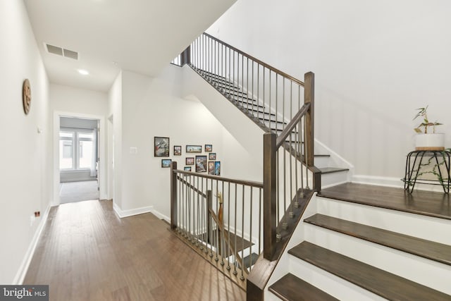 1702 River Sandstone Ter SE, Leesburg, VA 20175 - staircase featuring wood finished floors, baseboards, and recessed lighting
