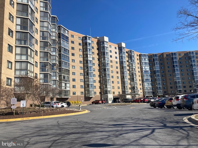 view of property featuring uncovered parking