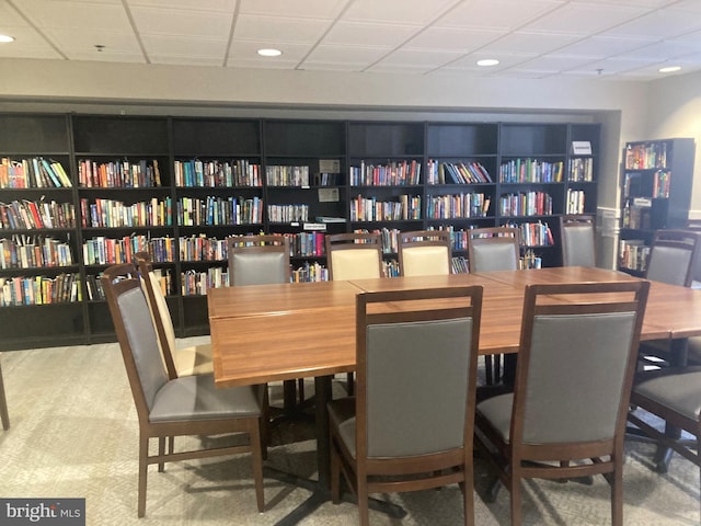 dining area with recessed lighting and a paneled ceiling