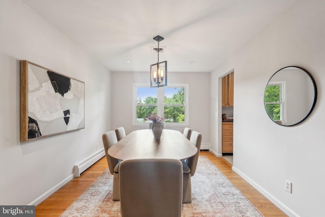1612 7th Pl, Mclean, VA 22101 - dining area featuring a baseboard heating unit, healthy amount of natural light, light wood-type flooring, and baseboards