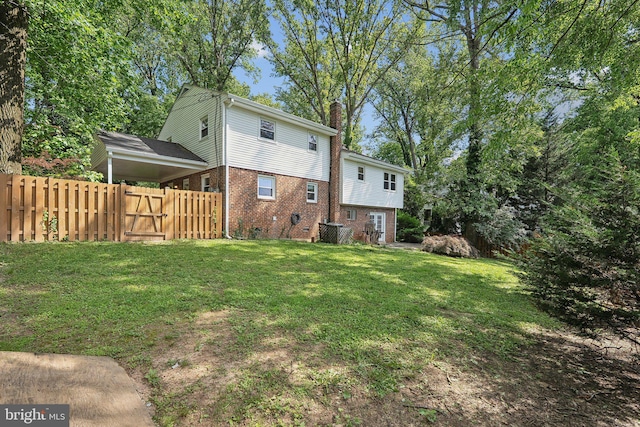 1612 7th Pl, Mclean, VA 22101 - rear view of property featuring brick siding, a chimney, central air condition unit, and a gate