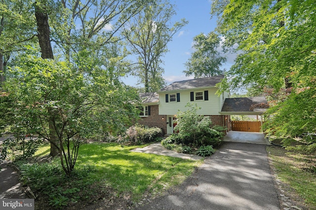 1612 7th Pl, Mclean, VA 22101 - tri-level home with asphalt driveway, brick siding, and an attached carport