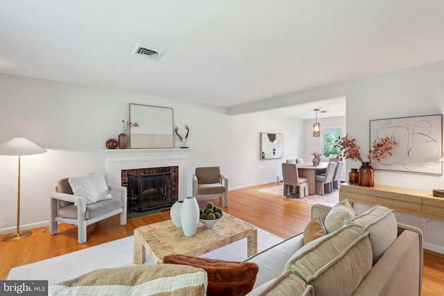 1612 7th Pl, Mclean, VA 22101 - living room featuring light wood-type flooring, a fireplace, and baseboards