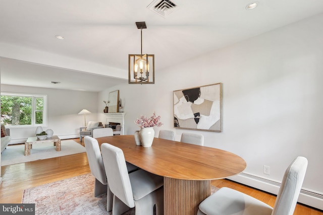 1612 7th Pl, Mclean, VA 22101 - dining area featuring wood finished floors, a chandelier, a fireplace, recessed lighting, and baseboards