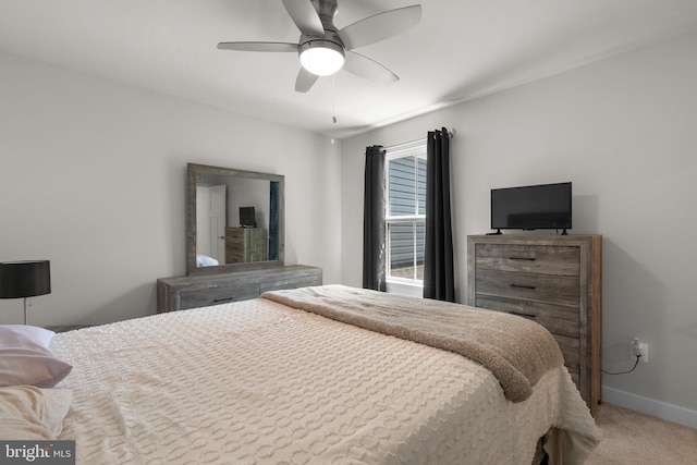 bedroom featuring baseboards, ceiling fan, and carpet flooring