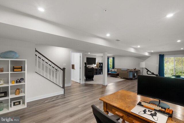 interior space with visible vents, stairs, baseboards, light wood-style floors, and recessed lighting