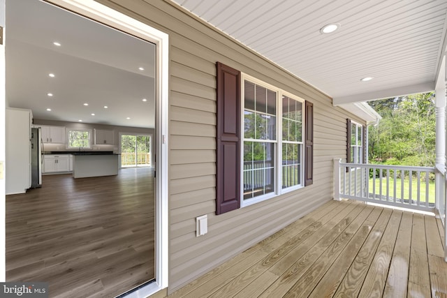 wooden terrace with a porch