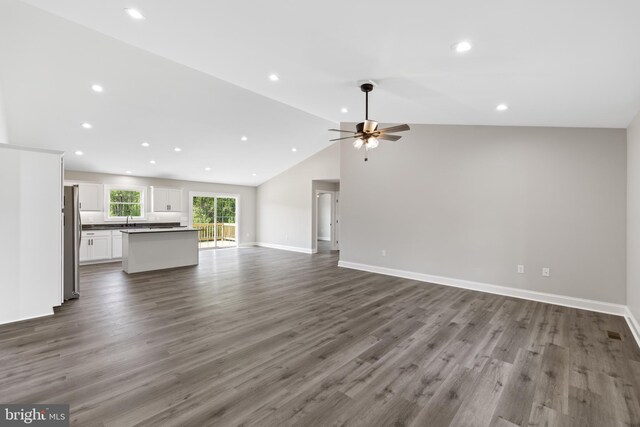 unfurnished living room featuring recessed lighting, a ceiling fan, lofted ceiling, and wood finished floors