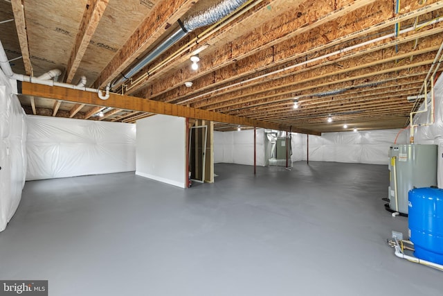 unfinished below grade area featuring water heater