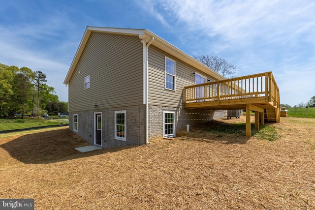 view of side of home with a deck